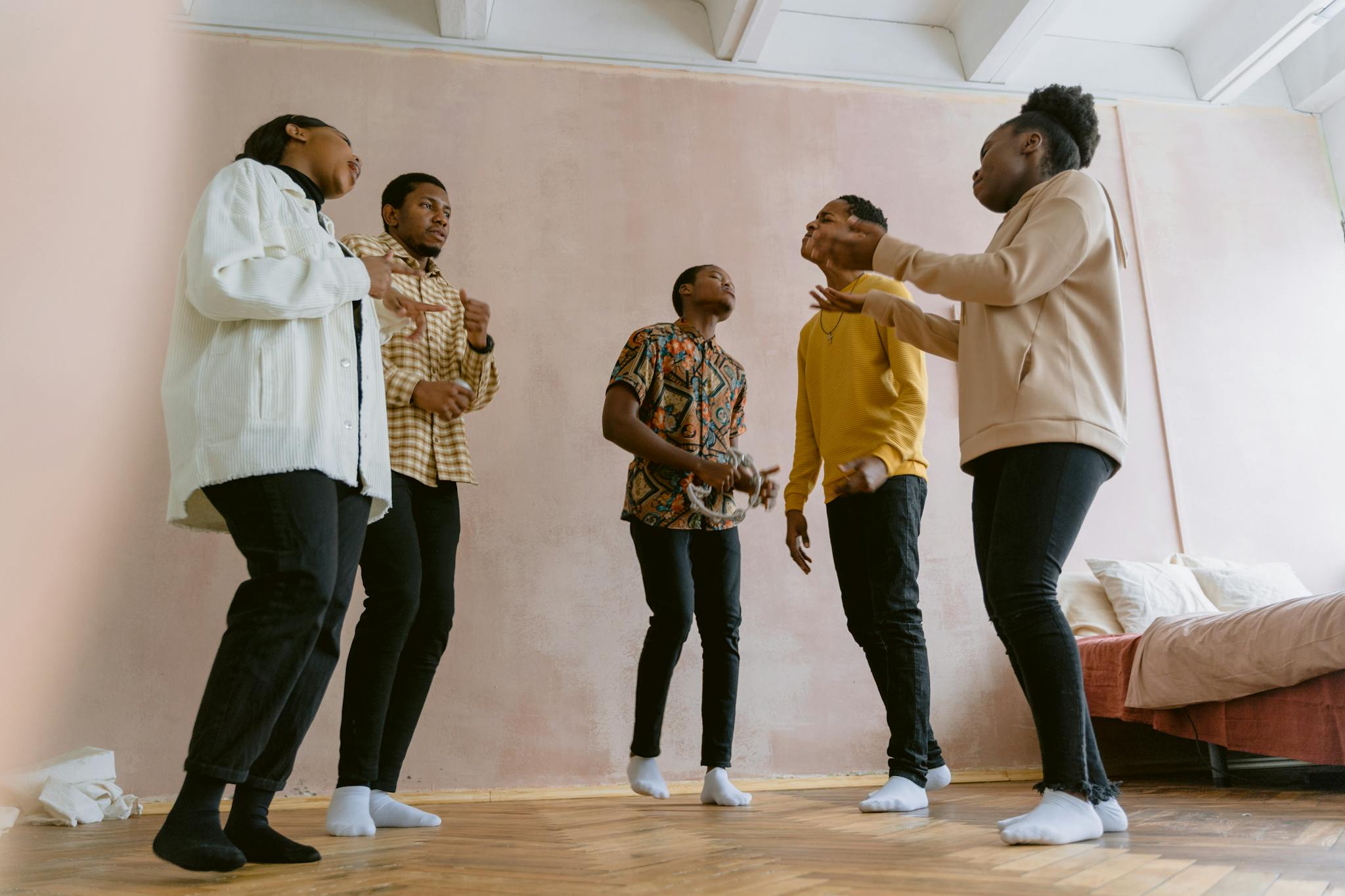 A diverse group of friends interactively rehearsing in a cozy indoor setting, conveying togetherness and creativity.